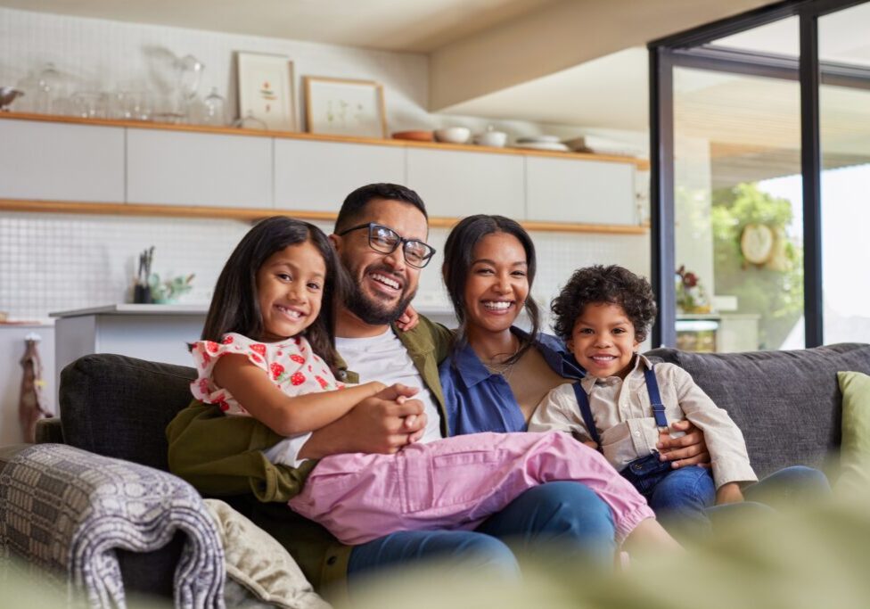 Happy,Multiethnic,Family,Having,Fun,At,Home,,Parents,And,Little